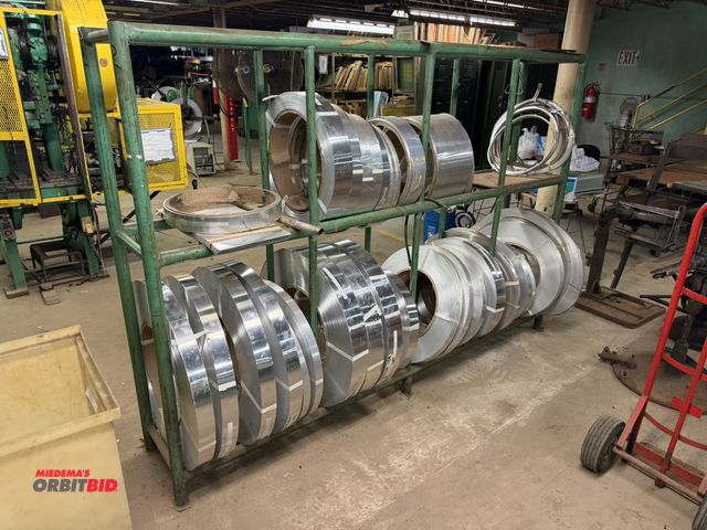 Lot 1-18466 - (1) rack, 99.5" long x 17" wide x 68.5" tall with coiled aluminum, includes various width rolls of a...