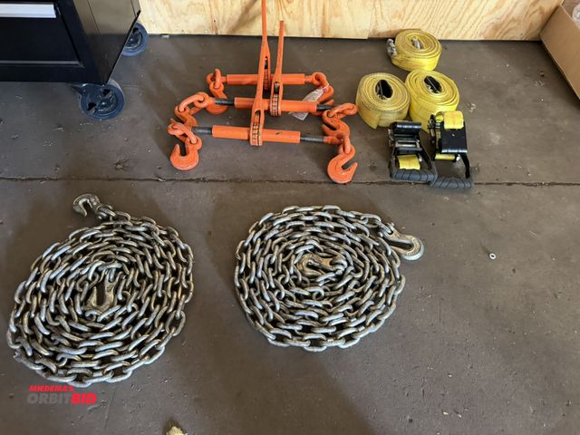 Lot 1-13168 - Lot of (3) ratcheting chain binders, (2) 3/8" double hook 20' chains, (2) 2" ratchet straps, and (1)...