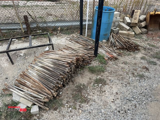 Lot 1-18454 - Large lot of cement stakes, includes 28", 36", 38", and plastic barrel filled with assorted stakes, ...