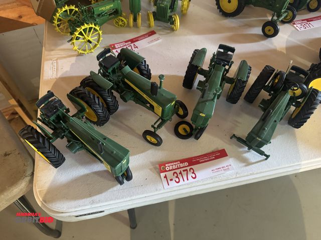 Lot 1-3173 - (4) John Deere Die cast Tractors, model 720, model 730 (model 730 has one tire off, model 720 has bo...