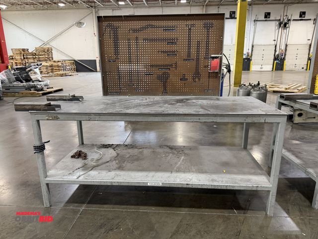 Lot 1-5398 - (1) 7' length x 37" height x 36" depth heavy duty steel work bench with custom made fork pockets on ...