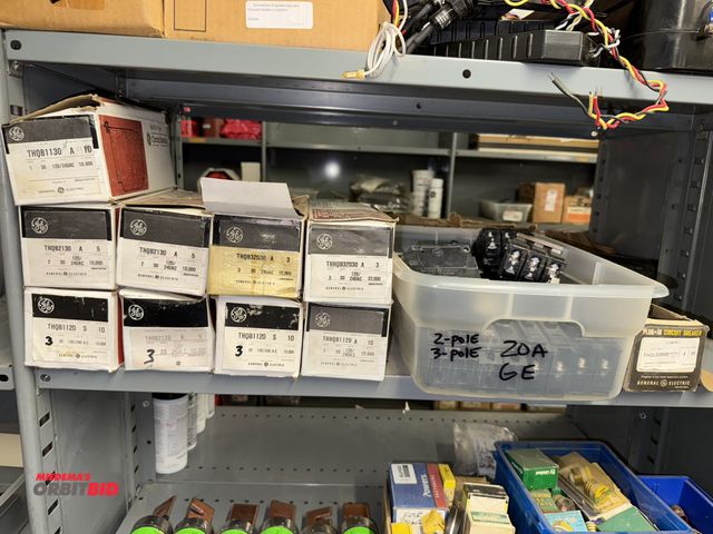 Lot 1-6410 - Large lot of GE circuit breakers, includes 2-pole 30 amp, single pole 30 amp, 3 pole 20 amp, and muc...