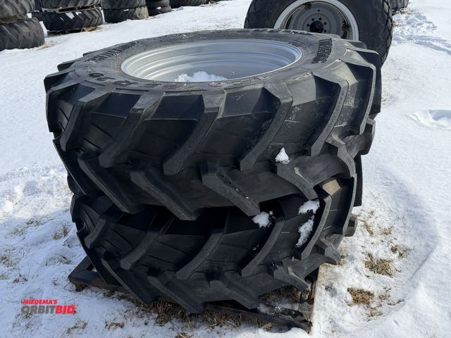 Lot 1-11615 - (1) set of Trelleborg TM600 tires, size 16.9R30, mounted on 8-bolt rims.