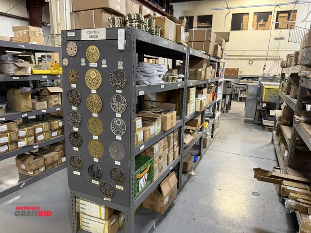 Lot 1-18908 - Entire contents of shelf, includes assorted decorative clock trim pieces, Howard Miller Clock Compan...