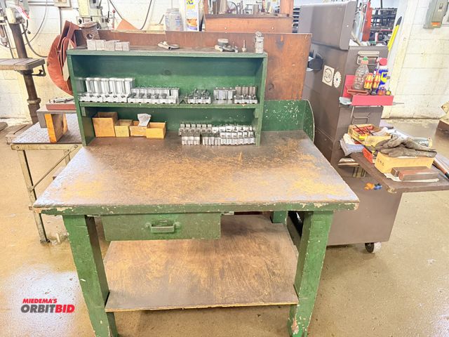 Lot 1-6507 - (1) wooden shop table, 48" x approx. 30" x 54" tall, with assorted chuck jaws.