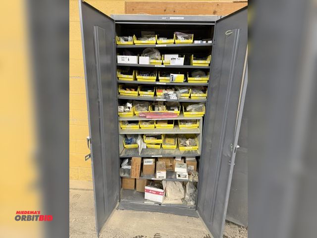 Lot 1-16786 - (1) Tennsco 2-door storage cabinet filled with assorted CNC router parts, includes bearings, Parker ...