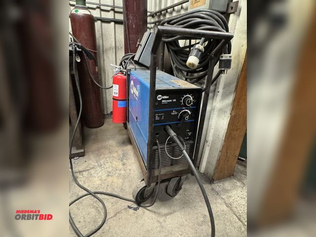 Lot 1-2566 - (1) Millermatic 185 wire welder, 3 phase, mounted on cart, with transformer, extension cord, and Mil...