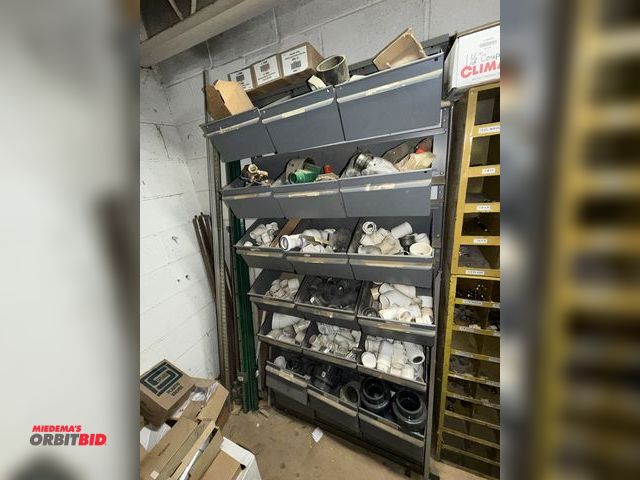 Lot 1-16827 - (1) rack with contents, includes assorted PVC elbows, T's, unions, Schedule 80 unions (various sizes...
