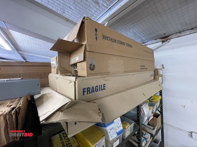 Lot 1-6199 - Large assortment of fluorescent bulbs, 2 x 4 troffer lens covers, and more.