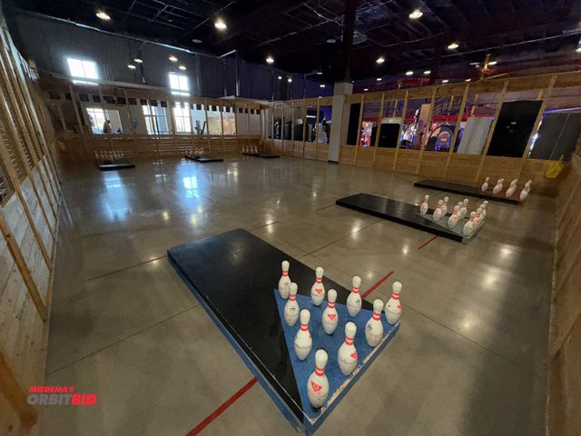 Lot 1-11266 - (1) Football bowling game structure, includes (6) boards with pins, footballs, includes wood surroun...