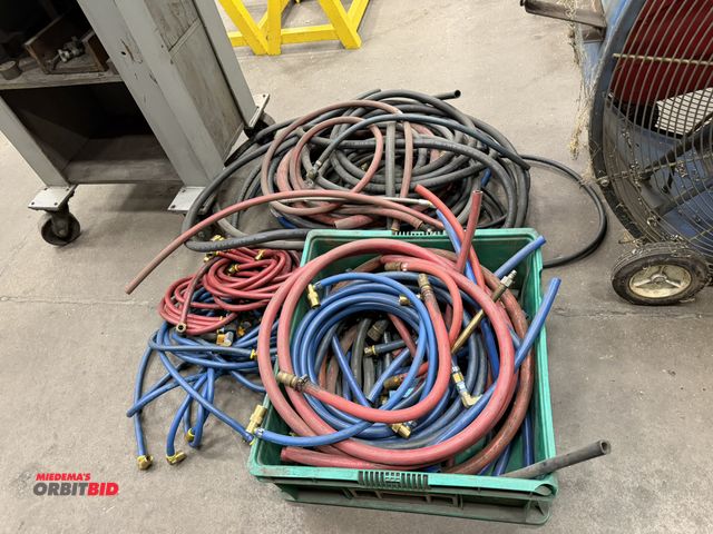 Lot 1-15202 - Large lot of assorted air hose with air regulators and Quick Connections, assorted lengths and sizes...