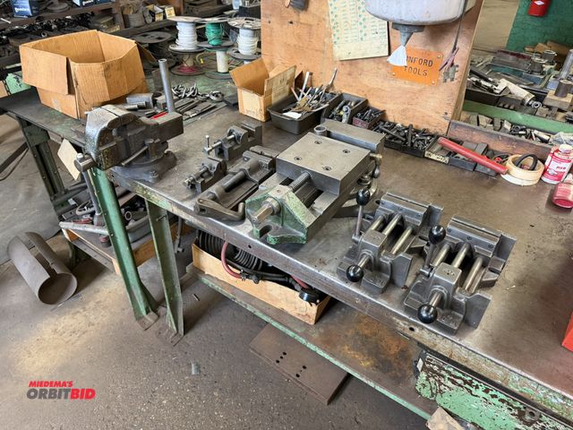 Lot 1-18541 - (1) 60" width x 34" height x 30" depth steel work bench with steel lower shelf, and a Columbia 3" be...