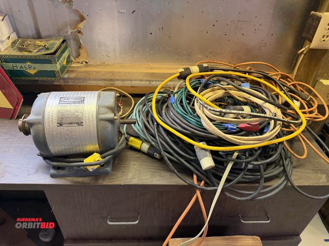 Lot 1-12322 - Large lot of assorted extension cords with plug ends, and (1) Craftsman 3 HP motor, may be for parts...