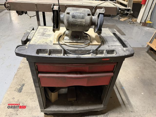 Lot 1-18649 - (1) Delta 6" bench grinder with Rubbermaid Action Packer rolling, 2-drawer tool box, assorted socket...