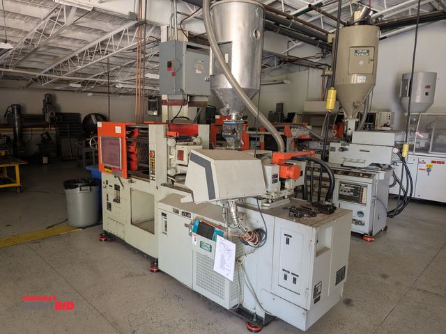 Lot 1-6597 - Kawaguchi K45-B 49 ton Plastic Injection Molding Machine, SN 70679, includes a funnel with an assort...