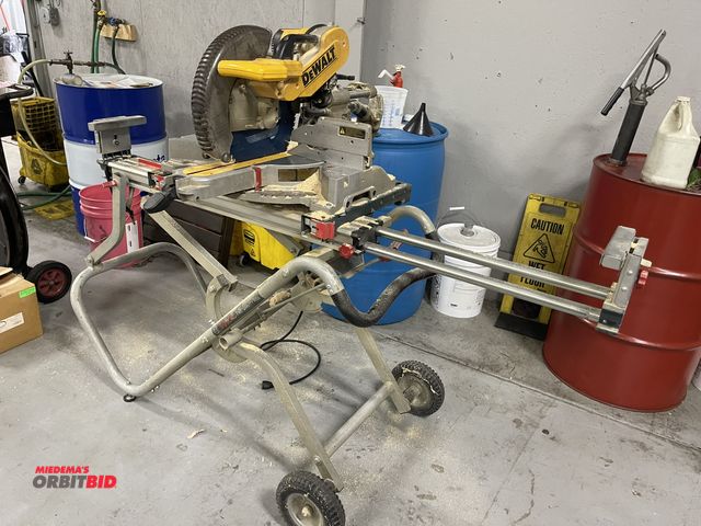 Lot 1-19367 - (1) DeWalt, model DW718, 12" compound miter saw, includes portable Bosch saw table.