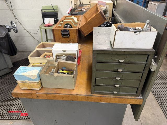 Lot 1-1785 - Large lot of assorted grinding wheels, attachments, machine parts, drill bits, and more.