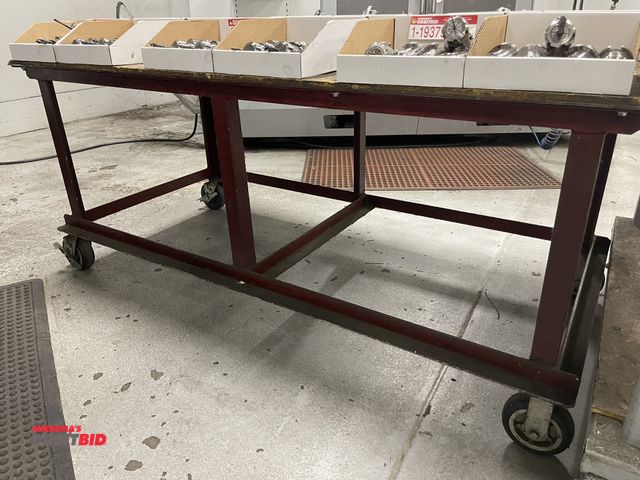 Lot 1-19382 - (1) 72" x 36" rolling, heavy duty steel shop table with wood top.