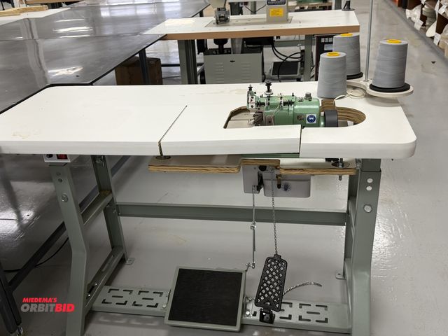 Lot 1-4878 - (1) Merrow, model MG-3DW-2, over seaming sewing machine, S/N 309139, includes power table, foot peda...