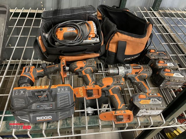 Lot 1-6276 - Lot of assorted Ridgid cordless tools, includes (2) impact, (1) hammer drill, flashlight, (4) batter...