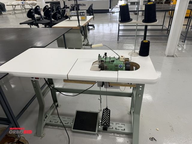 Lot 1-4865 - (1) Merrow, model MG-3DW-2, over seaming sewing machine, S/N 309139, includes power table, foot peda...