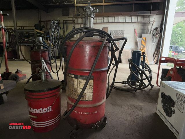 Lot 1-18134 - Lot including (1) approx. 20 gallon capacity grease can with 4-wheel base, and a Lincoln Engineering...