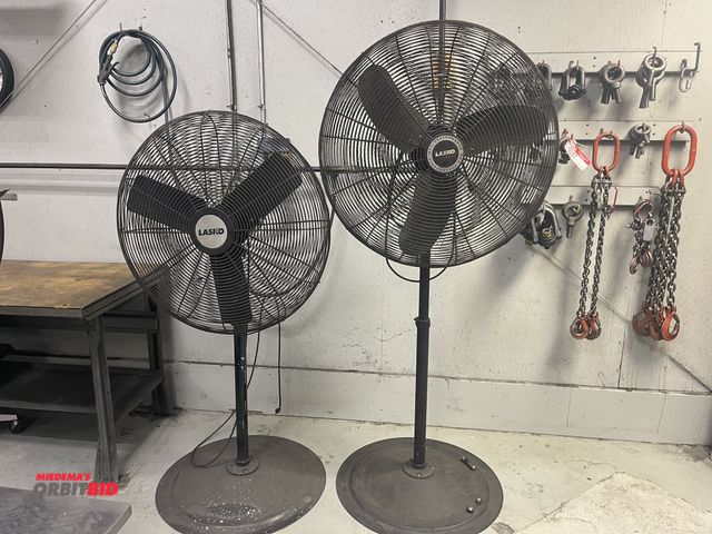 Lot 1-19258 - Lot of (2) 30" diameter Lasko pedestal shop fans.