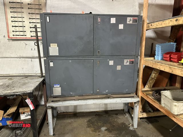 Lot 1-14425 - (1) 65" width (with fins) x 55" height x 11" depth steel storage unit (made of two units welded toge...