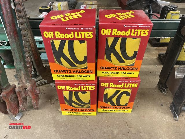 Lot 1-6248 - Lot of (4) KC quartz Halogen, long range, 100 watt off road lights, new in box.