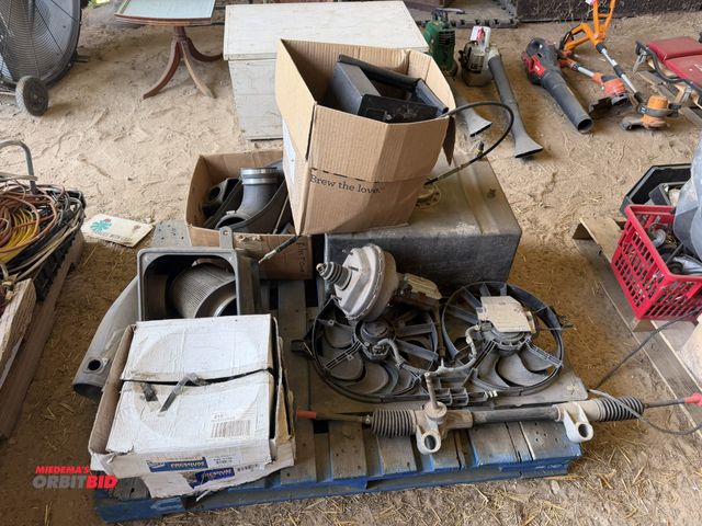 Lot 1-8536 - Large lot of assorted automotive items, includes cooler fan, air boxes, NAPA Premium brake drums, st...