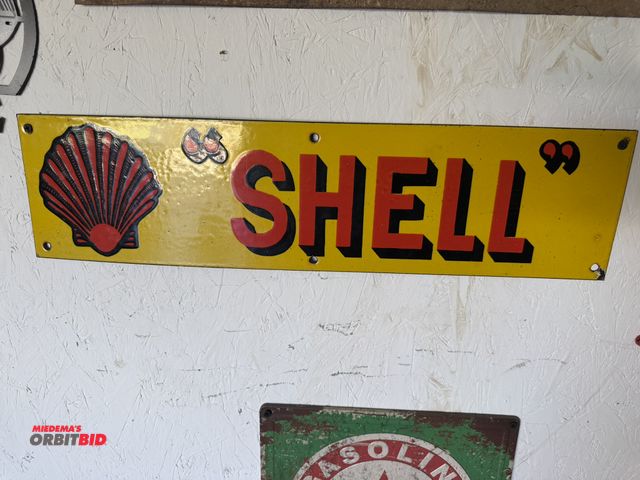 Lot 1-8198 - (1) 24" x 6" porcelain coated "Shell" tin sign.