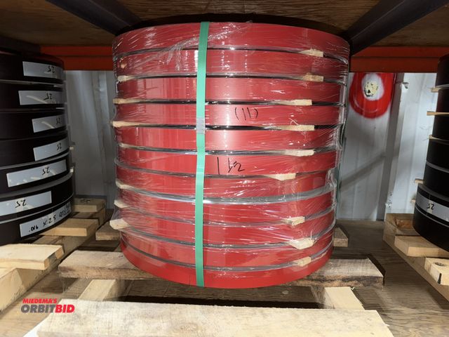 Lot 1-18775 - Lot of (11) coils of 1.5" wide  x .016" thickness aluminum banding, red on one side black on the oth...