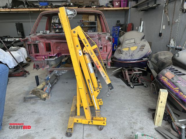 Lot 1-580 - (1) Performance Tool cherry picker, 2-ton capacity, on casters, in working condition.
