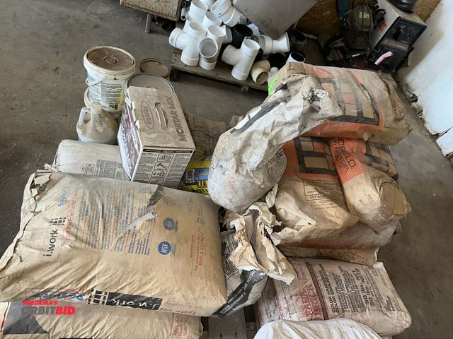 Lot 1-14134 - Large lot of assorted concrete building supplies, includes (2) 94 lb. bags of Type I/II, Portland Ce...