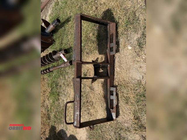 Lot 1-9586 - (1) post hole auger skid steer attachment frame, frame only.