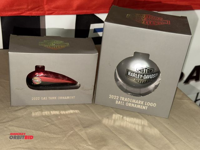 Lot 1-8273 - (1) 2022 Gas Tank Collectible ornament, and (1) 2022 Harley Davidson logo bulb.