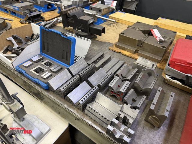 Lot 1-10259 - Large assortment of V-blocks, includes (1) magnetic V-block, 2.5" x 5 1/4" x 3", set of 4" x 2.5" x ...