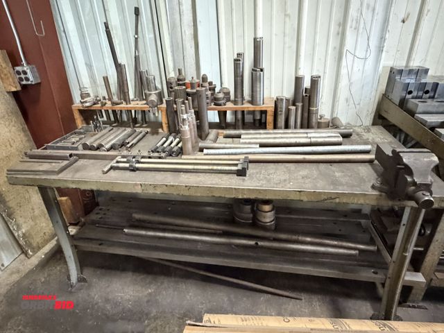 Lot 1-6284 - (1) 72" width x 32" height x 30" depth work bench with contents, including various solid round stock...