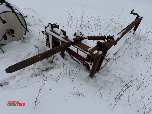 Lot 1-10427 - (1) unknown brand pallet fork attachment with mounting frame, forks are 42" length, unknown which mo...