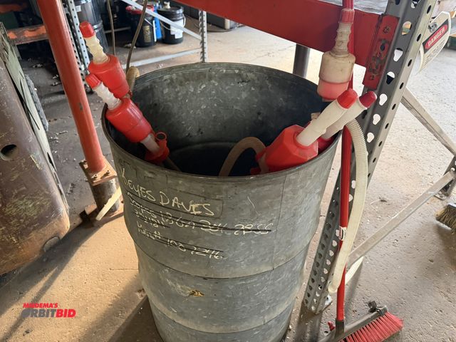 Lot 1-18660 - (1) 55 gallon drum with 5 various plastic drum pumps.