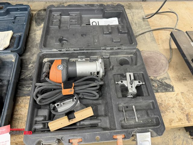 Lot 1-16592 - (1) Ridgid R2400 variable speed router with case and accessories.