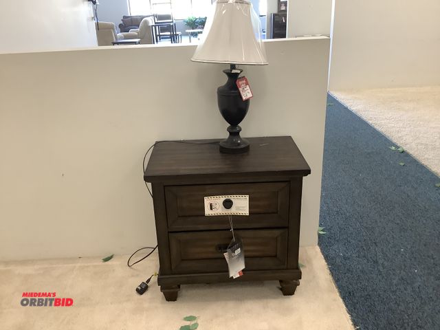 Lot 1-17233 - New Classic Furniture end table with USB charging port and a lamp. Measures 29” wide by 18” deep by ...
