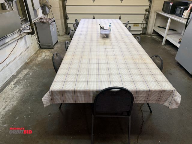 Lot 1-6365 - (1) 8' long banquet style table with a wood top screwed to top, and (14) metal frame, padded seat an...