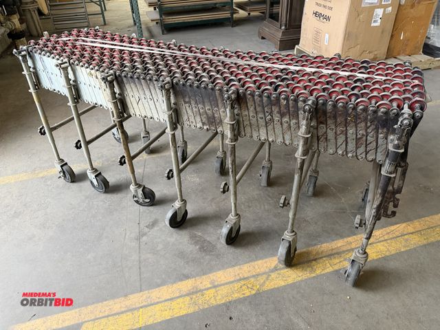 Lot 1-17354 - (1) extendable roller conveyor on wheels, with adjustable height legs (unit is approx. 6' long x 16"...