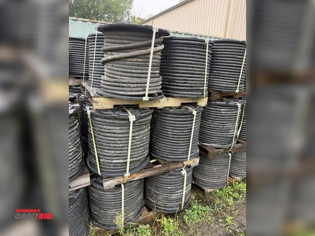 Lot 1-18751 - (3) skids/(12) spools of 1" heavy duty rubber hose, 1" OD with 1/4" wall, approx. 5/8" center diamet...