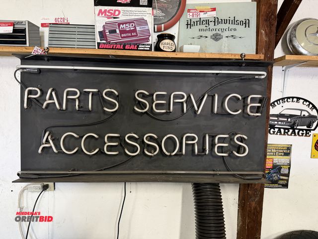 Lot 1-8243 - (1) approx. 46" width x 20" height "Parts Service Accessories" neon sign with a flat black resin bac...