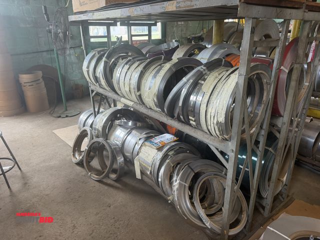 Lot 1-18749 - (1) 87" length x 66" height x 24" depth, 2-tier steel pipe roll stand with contents of rolls of brus...