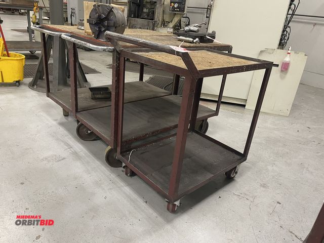 Lot 1-19453 - Lot of 3 heavy duty steel rolling shop carts with wood tops, (2) 48" x 24", and (1) 32" x 22".