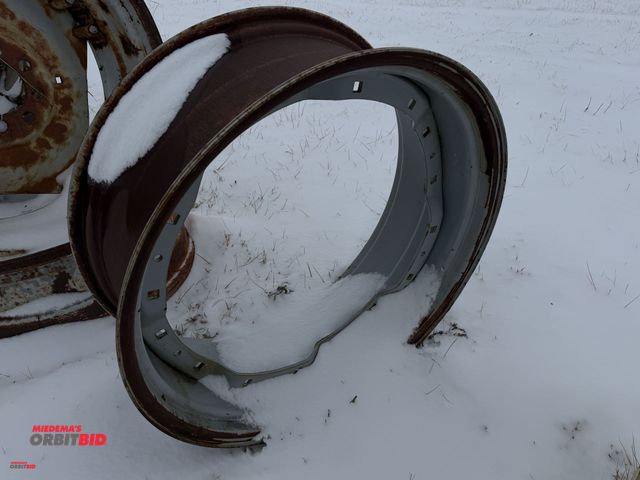 Lot 1-11661 - (1) tractor tire rim, approx. 33.5" diameter, 13" from inside of bead to inside of bead.