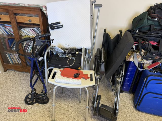 Lot 1-19203 - Large lot of assorted medical items, includes crutches, walker, wheelchair, BP monitor, and pillow w...